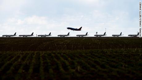 A Southwest Airlines flight takes off as United Airlines planes sit parked on a runway at Denver International Airport as the coronavirus pandemic slows air travel on April 22, 2020 in Denver, Colorado. Compared to the same time last year, Denver International Airport is operating 1,000 fewer flights daily. (Photo by Michael Ciaglo/Getty Images)